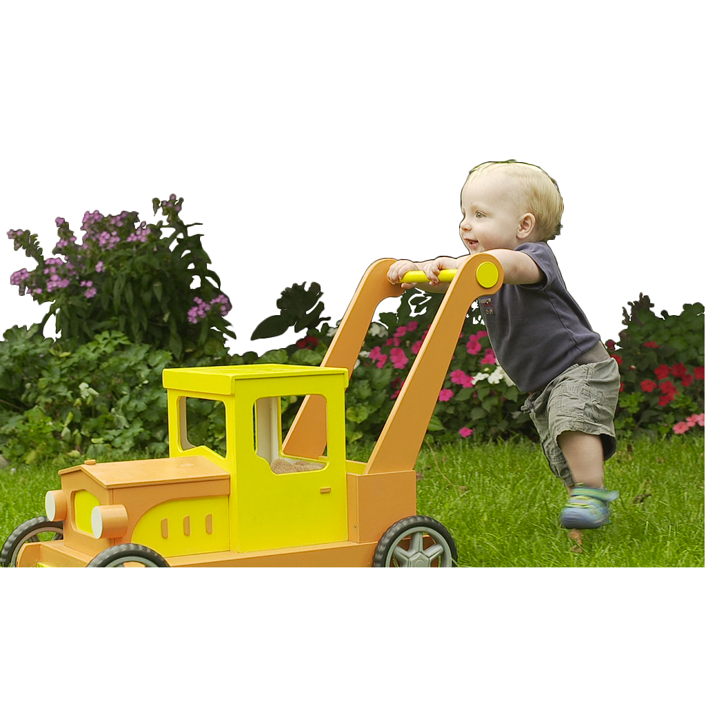 A toddler pushing a yellow toy truck for unfinished doll houses